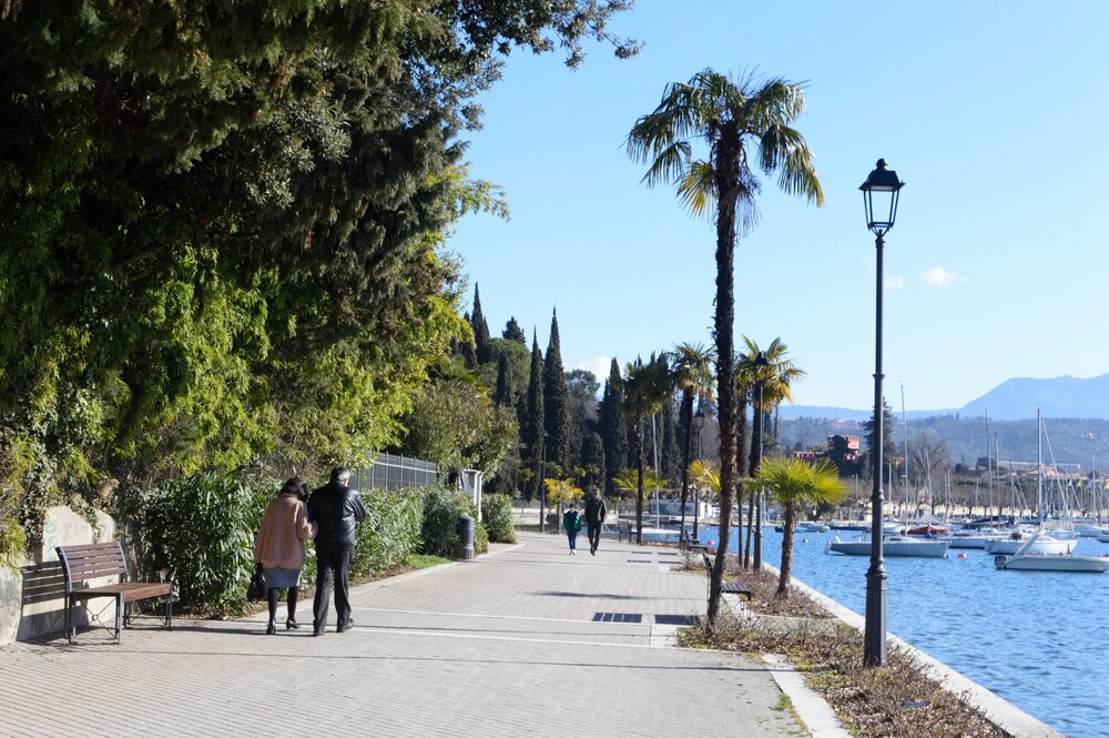 On sunny days, locals take a leisurely promenade on the lake promenade